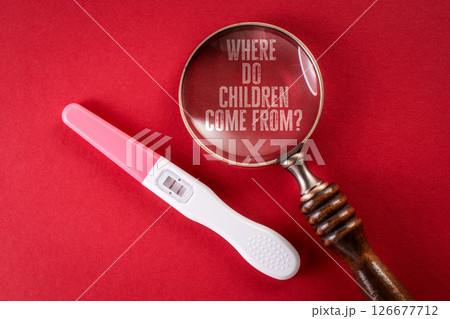 Where do children come from. Pregnancy Test and Magnifying Glass Where do children come from. Pregnancy Test and Magnifying Glass 126677712