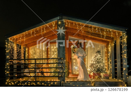 Christmas Lights Cabin Woman Decorated Holiday Christmas Lights Cabin Woman Decorated Holiday 126678199