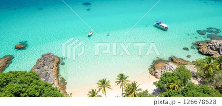 Tropical beach with turquoise sea, sandy coastline, palm trees, relaxation destination, perfect summer getaway, outdoor leisure, idyllic landscape, boats on water, peaceful vibes, adventure escape Tropical beach with turquoise sea, sandy coastline, palm trees, relaxation destination, perfect summer getaway, outdoor leisure, idyllic landscape, boats on water, peaceful vibes, adventure escape 126678628
