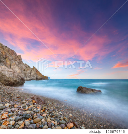 Amazing view of the beach and rocks shot with a long exposure. Amazing view of the beach and rocks shot with a long exposure. 126679746
