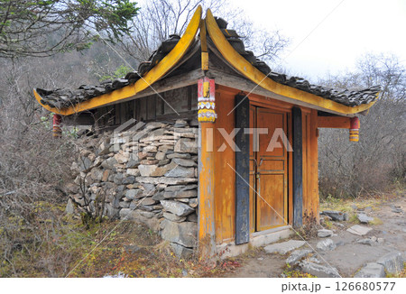 Photo of a Chinese Tibetan style house in the woods Photo of a Chinese Tibetan style house in the woods 126680577