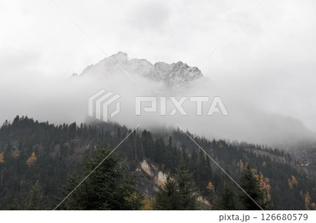Photo of mountains shrouded in clouds and fog 126680579