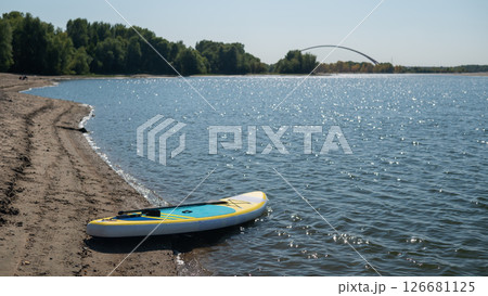 SUP board on a sandy beach. Summer sport. 126681125