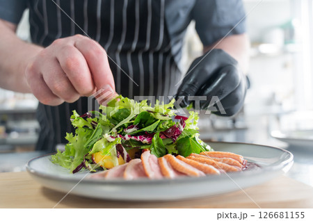 The chef serves roast duck. The chef serves roast duck. 126681155