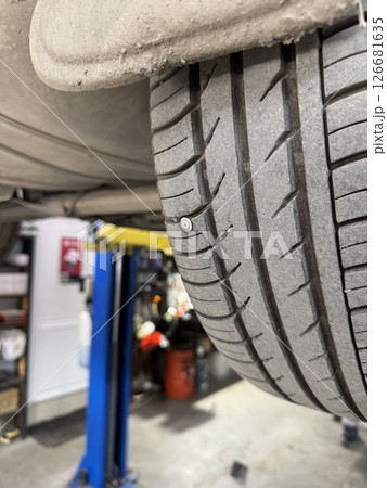 Close-up of a screw in a car wheel.  126681635