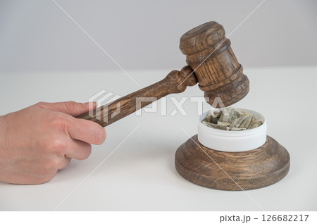 Judge Bangs Gavel. Chewing Tobacco Ban.  126682217