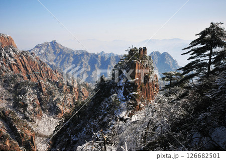 Mountain landscape after heavy snowfall, trees covered with snow and rime, China, Anhui Province, Mount Huang 126682501