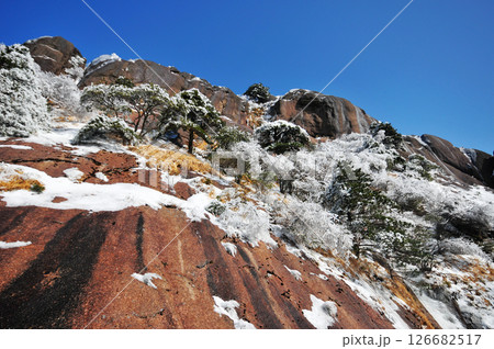 Mountain landscape after heavy snowfall, trees covered with snow and rime, China, Anhui Province, Mount Huang Mountain landscape after heavy snowfall, trees covered with snow and rime, China, Anhui Province, Mount Huang 126682517
