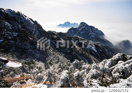 Mountain landscape after heavy snowfall, trees covered with snow and rime, sea of fluffy misty clouds ,China, Anhui Province, Mount Huang 126682532