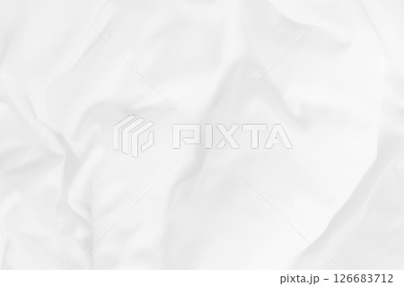 Close up top view of white bedding sheet and wrinkle messy blanket in bedroom after wake up in the morning. 126683712