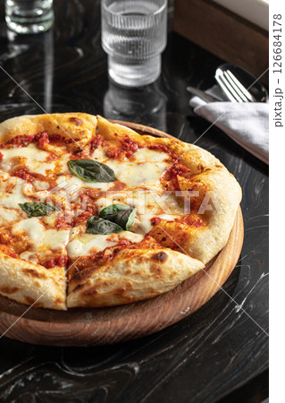 Portion of baked italian pizza margherita 126684178