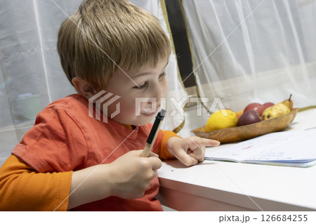 Preschooler kid drawing and learning, having fun at home Preschooler kid drawing and learning, having fun at home 126684255