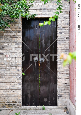 a locked wooden door in traditional Chinese style a locked wooden door in traditional Chinese style 126684336