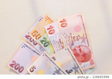 Turkish lira currency denominations mixed are neatly arranged, showcasing their vibrant designs Turkish lira currency denominations mixed are neatly arranged, showcasing their vibrant designs 126685999