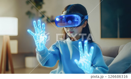 A young girl explores virtual reality, technology innovation immersive experience with blue digital effects, and digital worlds. 126686316
