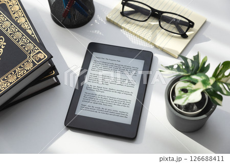E-book reader device in home library E-book reader device in home library 126688411