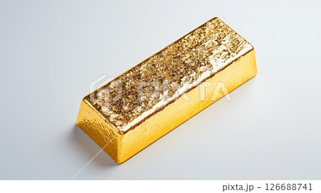 Stunning closeup of a gleaming gold nugget on a pristine white surface for luxurious visual appeal 126688741