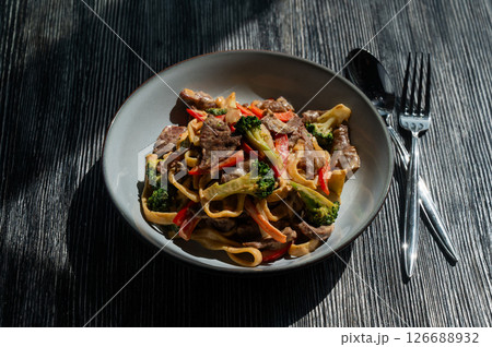 Pasta with beef, mushrooms and vegetables. Pasta with beef, mushrooms and vegetables. 126688932