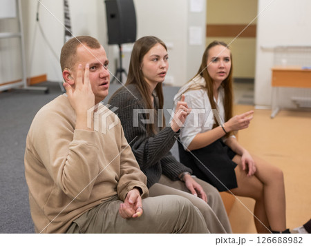 Hearing impaired students communicate during breaks at the university.  126688982
