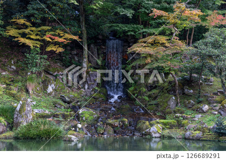 Kenrokuen Garden, Kanazawa, showing a forest waterfall flowing through mossy stones Kenrokuen Garden, Kanazawa, showing a forest waterfall flowing through mossy stones 126689291