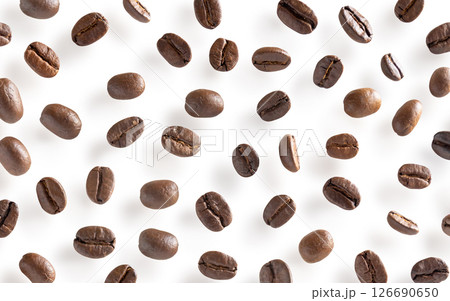 Roasted coffee beans. Scattered coffee beans on a white background with clipping paths. Close up image. 126690650