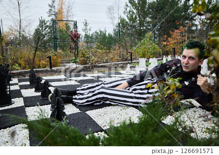 A Creative Chess Themed Photoshoot Taking Place in the Beautiful Outdoors of Nature 126691571