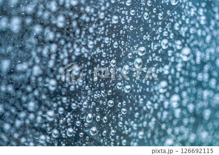 Rain drops on the glass dark moody texture background 126692115