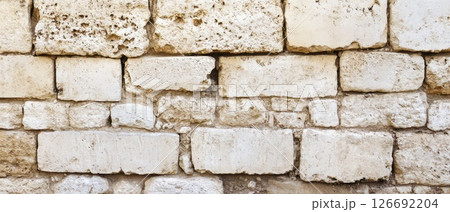 Old weathered stone wall with texture and detail 126692204