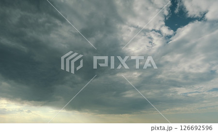 Dynamic and Artistic Cloud Formation Beautifully Captured in a Serene and Tranquil Sky Time lapse. 126692596