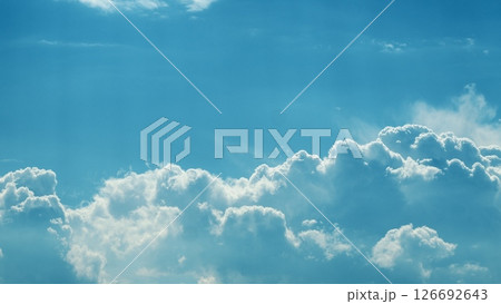 The Serene Blue Sky with Fluffy White Clouds during a Bright and Beautiful Daylight Time lapse. The Serene Blue Sky with Fluffy White Clouds during a Bright and Beautiful Daylight Time lapse. 126692643