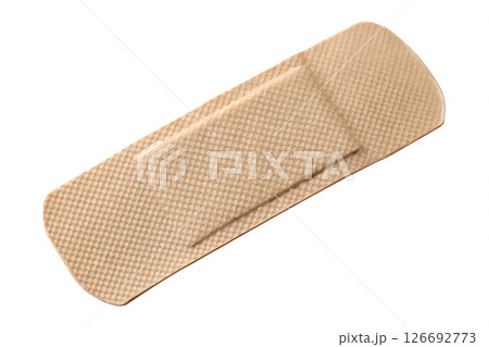 Sterile adhesive bandage on transparent background, ready to cover small cuts or wounds, beige skin tone, medical first aid supply 126692773