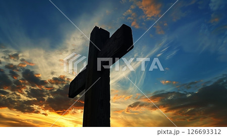 A massive lumber beam stands vertically, creating a striking silhouette against a dramatic, cloudy sky. A massive lumber beam stands vertically, creating a striking silhouette against a dramatic, cloudy sky. 126693312