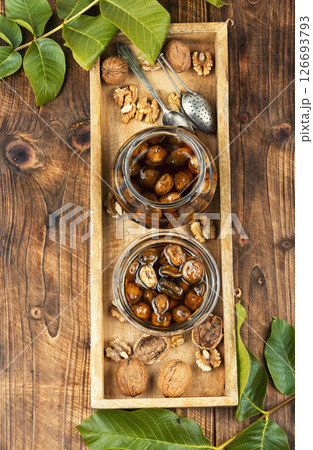 Delicious walnut jam and peeled walnut. Delicious walnut jam and peeled walnut. 126693793