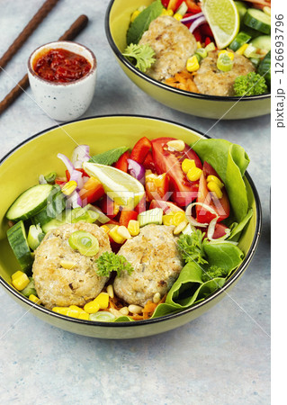 Lunch bowl of fish cutlets. 126693796
