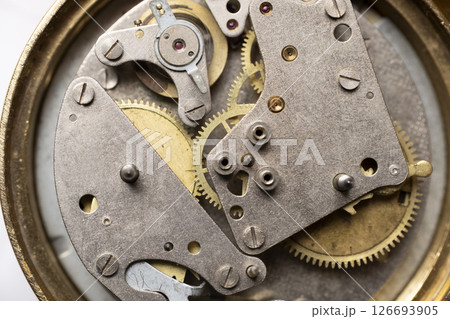 round mechanic movement of old watch isolated on white background round mechanic movement of old watch isolated on white background 126693905