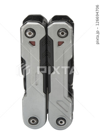 Folded multitool isolated on white background in top view. Daily practice tool. All-in-one. Improved construction tools. Construction and Repair. Compact and portable product. Secure form. 126694706