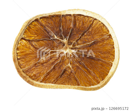 Dried orange isolated on a white background. Dried orange slice macro Dried orange isolated on a white background. Dried orange slice macro 126695172