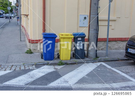 Nitra, Slovakia - 05.21.2025: Different colored bins for collecting materials for recycling. 126695865