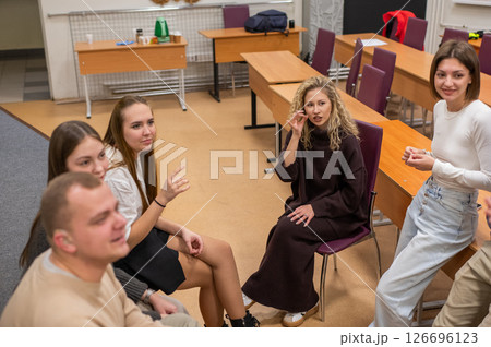 Hearing impaired students communicate during breaks at the university.  126696123
