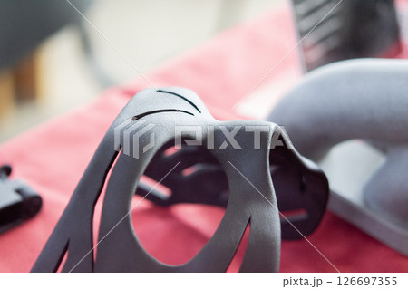 Black Costume Face Mask printed on 3D printer from plastic. An object created on a 3D printer from sintered plastic powder. New modern additive technologies. 3D Printing technology 126697355