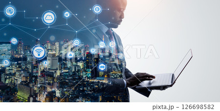 ノートパソコンを使うビジネスパーソンとデジタルネットワークのコラージュ ノートパソコンを使うビジネスパーソンとデジタルネットワークのコラージュ 126698582