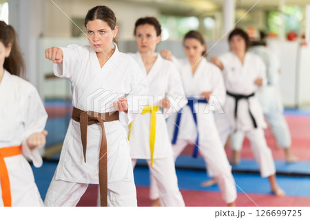Female athletes standing in formation, kata starting position Female athletes standing in formation, kata starting position 126699725