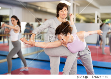 Women practice self-defense techniques in pairs Women practice self-defense techniques in pairs 126699840