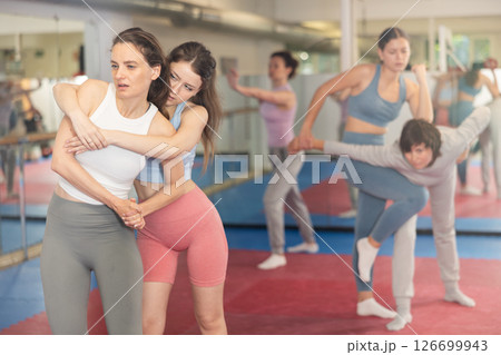 Women practicing gifts in self-defense training 126699943