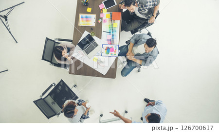Top view business people meeting together at office desk in conference room. Team business meeting partnership planning brainstorming together. Team Collaborate group of partner company brainstorming Top view business people meeting together at office desk in conference room. Team business meeting partnership planning brainstorming together. Team Collaborate group of partner company brainstorming 126700617