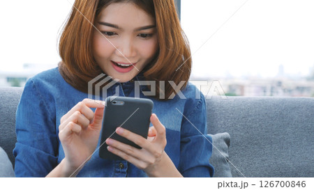 Asian woman using digital tablet shopping online, call, texting message internet technology lifestyle with smiling face. Asian woman touch smart tablet focus on hands using mobile app home office. Asian woman using digital tablet shopping online, call, texting message internet technology lifestyle with smiling face. Asian woman touch smart tablet focus on hands using mobile app home office. 126700846