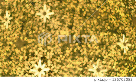 Warm golden bokeh lights with multiple glowing eight-pointed star shapes, creating a dreamy and festive atmosphere. Ideal for Christmas, New Year Warm golden bokeh lights with multiple glowing eight-pointed star shapes, creating a dreamy and festive atmosphere. Ideal for Christmas, New Year 126702082