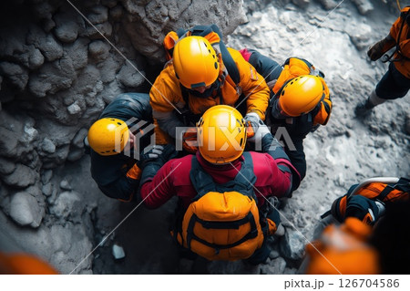 First responders assisting individuals after an emergency situation in a rugged environment 126704586