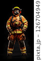 Firefighter poses confidently in full protective gear against solid black background 126704949