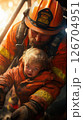 Firefighter rescues child while descending a ladder in a dramatic rescue operation 126704951